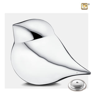 Adult Sized Silver SoulBird Shaped Male Cremation Urn with Urn Cap on the ground
