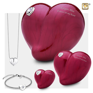 3 Different Sizes of Adult LoveHeart Shaped Pink Cremation Urns, A Heart shaped cremation pendant necklace and a heart shaped bracelet bead.